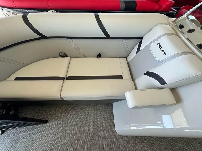 Slide: The Image of 2024 Crest Classic LX 220 SLC CPT boat interior with sleek white seating. - 3