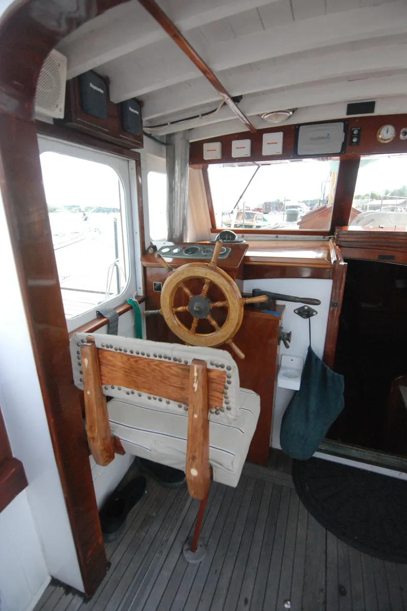 Slide: The Image of 1939 Concordia Motorsailer helm with wooden wheel and classic nautical design. - 20