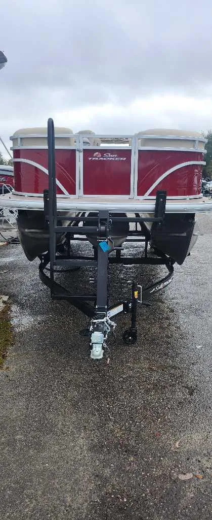 Slide: The Image of 2024 Sun Tracker Party Barge 22 RF XP3 on trailer, front view. - 3