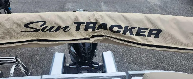 Slide: The Image of 2024 Sun Tracker Party Barge 22 RF XP3 boat cover and motor. - 9