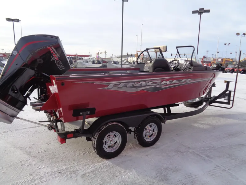 Slide: The Image of 2024 Tracker Targa V-19 WT boat on trailer in snowy parking lot. - 3