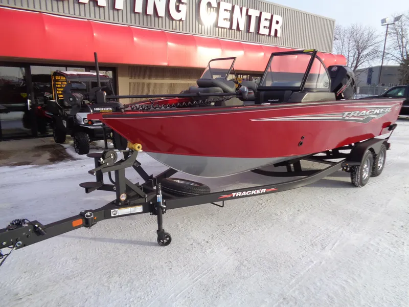 Slide: The Image of 2024 Tracker Targa V-19 WT boat on trailer, parked outside dealership. - 4