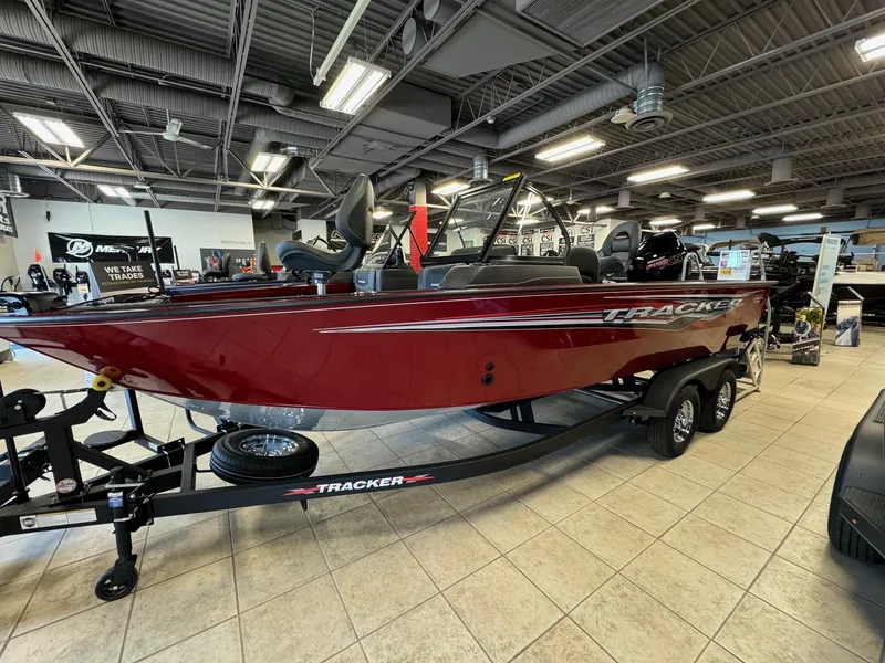 Slide: The Image of 2024 Tracker Targa V-19 WT boat displayed in showroom. - 7