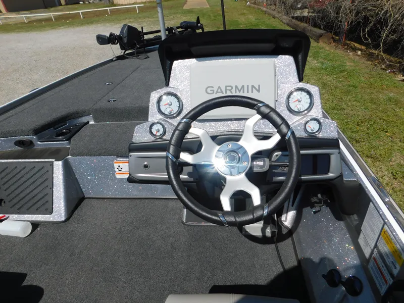 Slide: The Image of 2024 Nitro Z19 boat dashboard with Garmin display and steering wheel. - 4