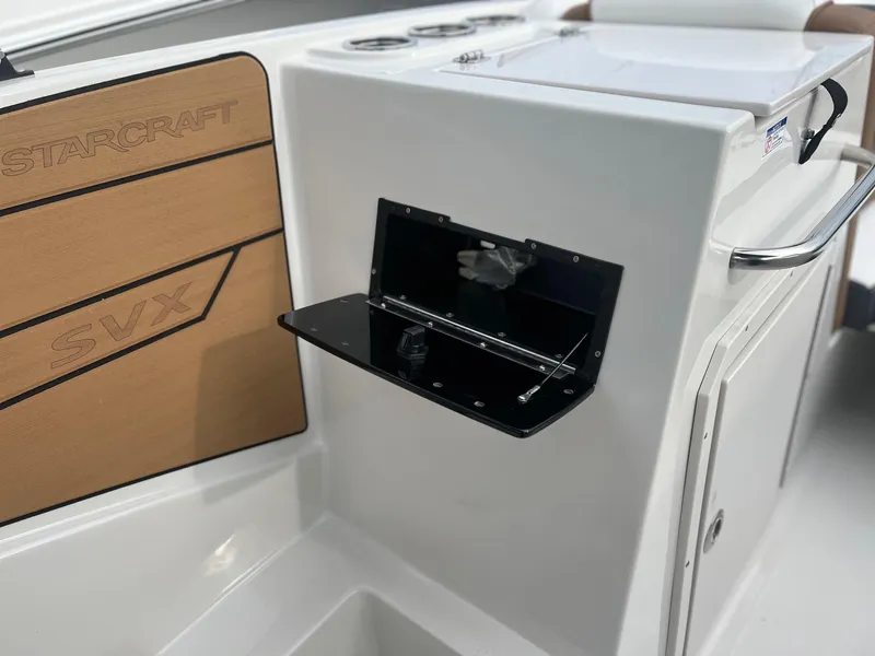 Slide: The Image of Interior of 2024 Starcraft SVX 231 OB DH with brown and white seating. - 10