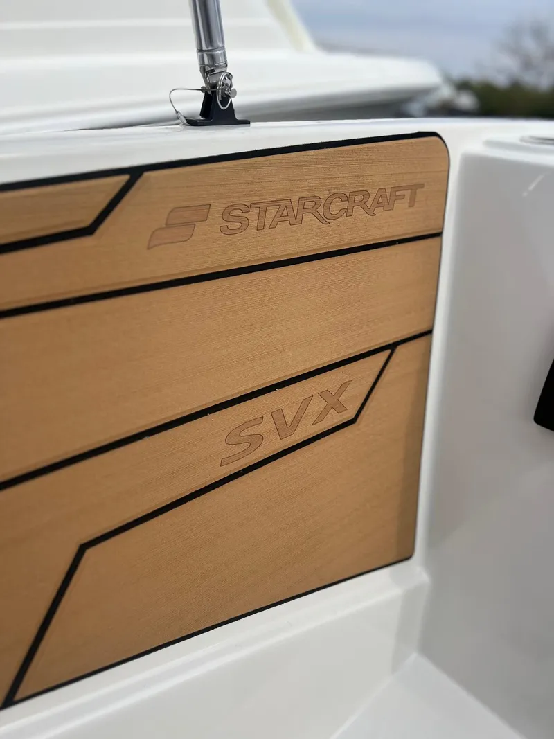 Slide: The Image of Interior of 2024 Starcraft SVX 231 OB DH boat with seating. - 11