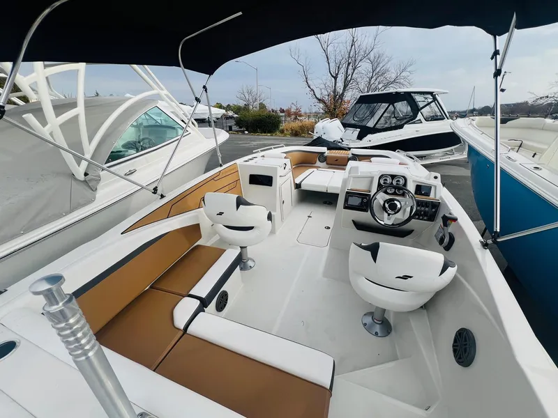 Slide: The Image of 2024 Starcraft SVX 231 OB DH boat interior with speakers. - 18