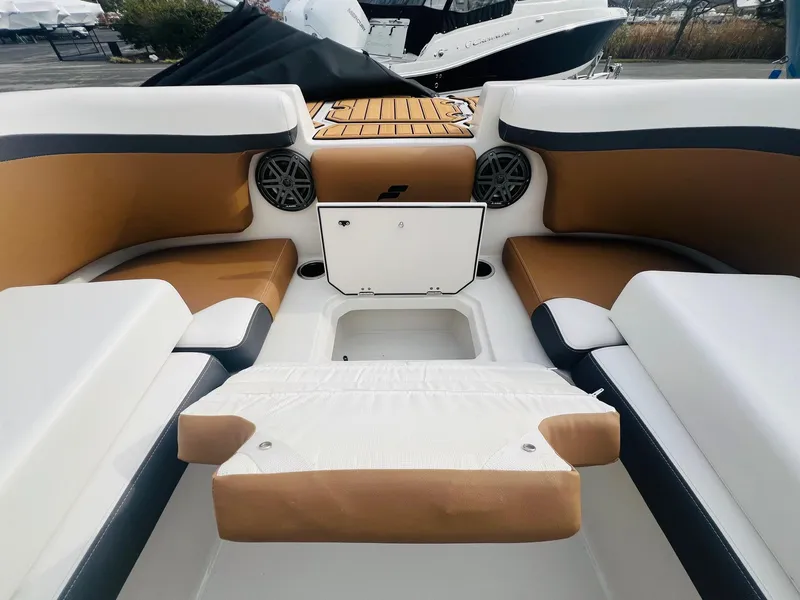 Slide: The Image of 2024 Starcraft SVX 231 OB DH boat with Bimini top and wood-look deck. - 25
