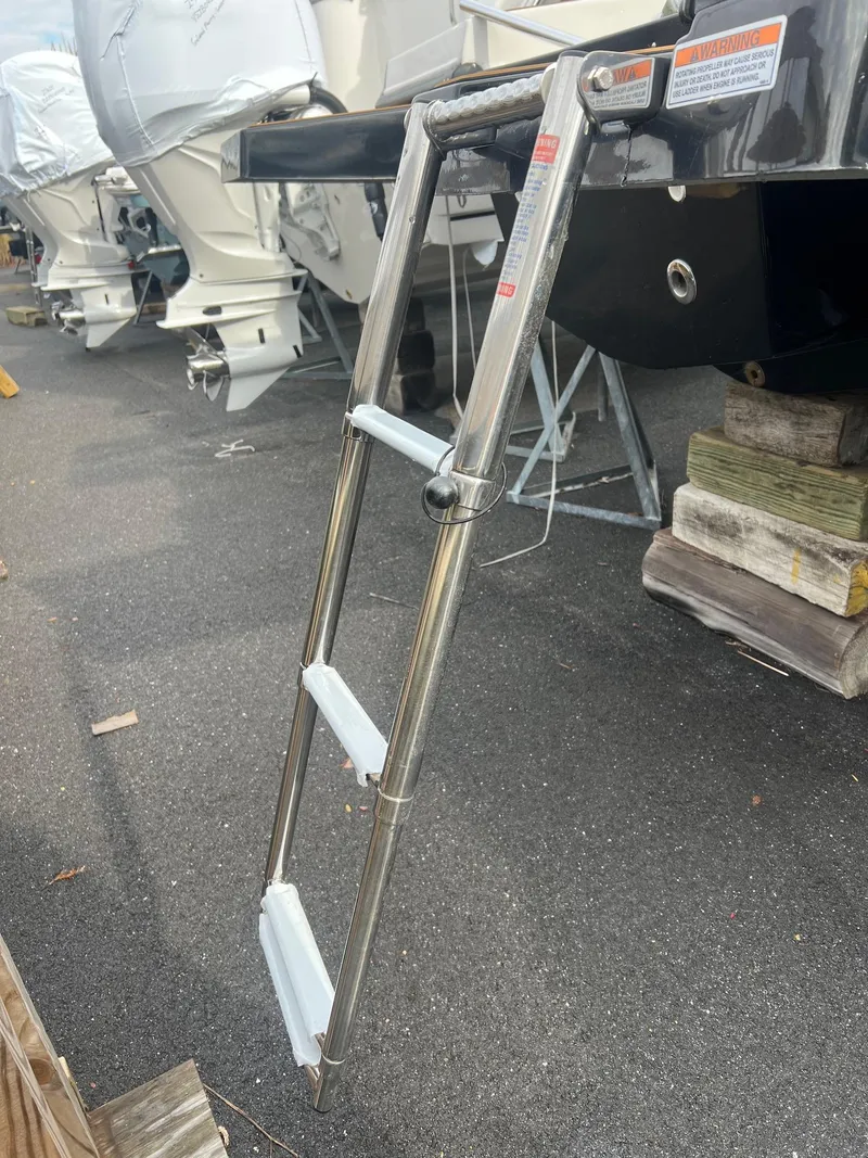 Slide: The Image of 2024 Starcraft SVX 231 OB DH boat in indoor setting. - 27