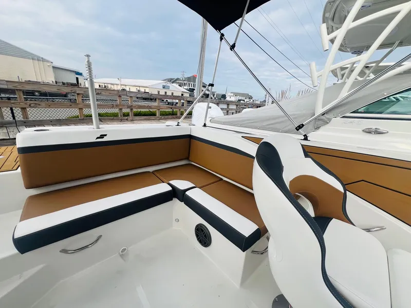 Slide: The Image of 2024 Starcraft SVX 231 OB DH boat in a showroom. - 4