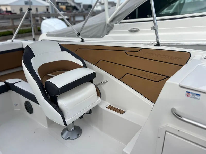 Slide: The Image of 2024 Starcraft SVX 231 OB DH boat dashboard with steering wheel. - 9