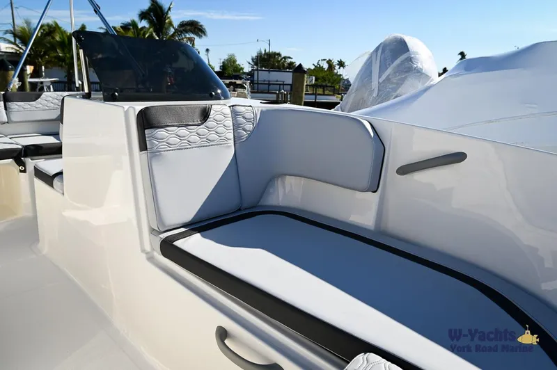 Slide: The Image of 2024 Bayliner M17 boat interior with cushioned seating and modern design. - 10