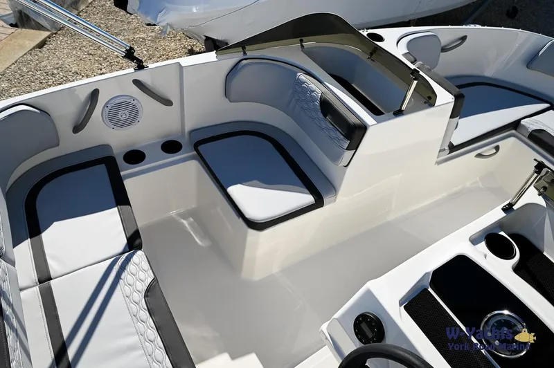 Slide: The Image of 2024 Bayliner M17 boat interior with seating and storage compartments. - 12