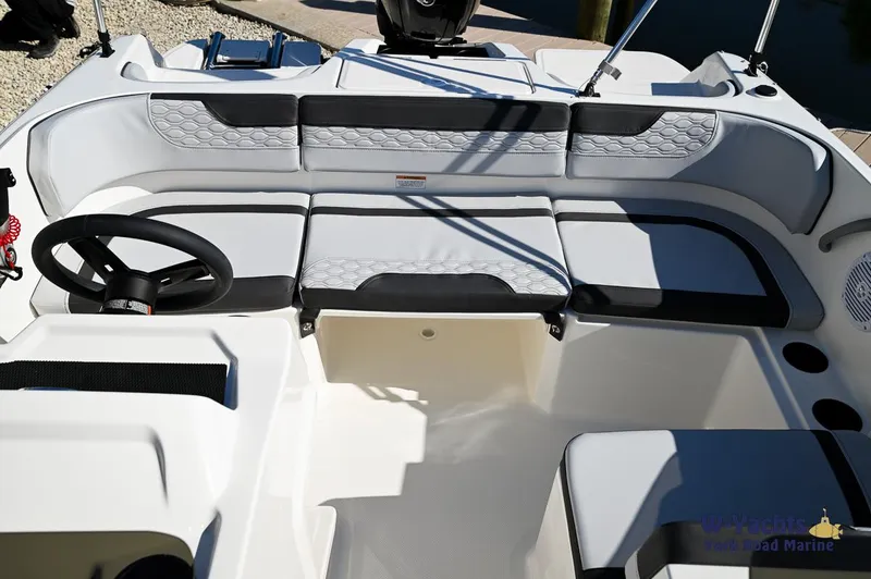 Slide: The Image of 2024 Bayliner M17 boat interior with white and gray seating. - 15