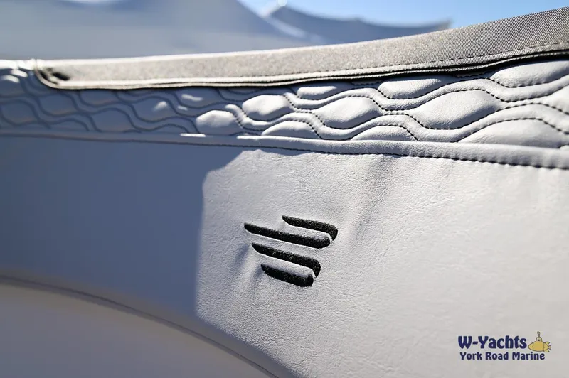 Slide: The Image of Close-up of 2024 Bayliner M17 boat interior with textured upholstery. - 19