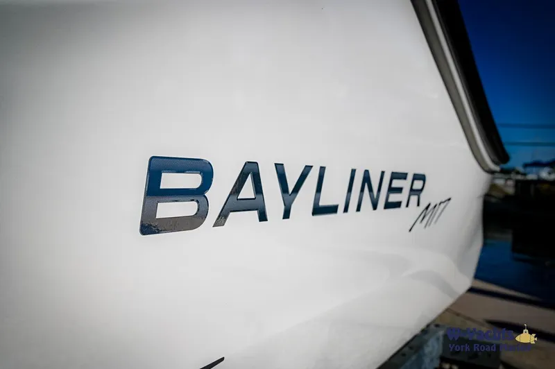Slide: The Image of 2024 Bayliner M17 boat side view with logo. - 2