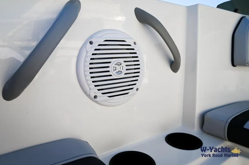 Slide: The Image of 2024 Bayliner M17 boat interior with speaker and cup holders. - 20