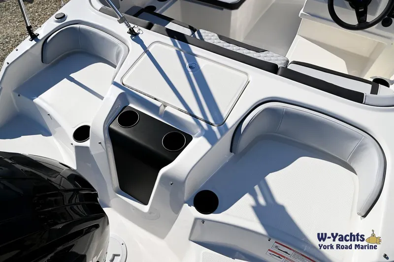 Slide: The Image of 2024 Bayliner M17 boat interior with seating and cup holders. - 21