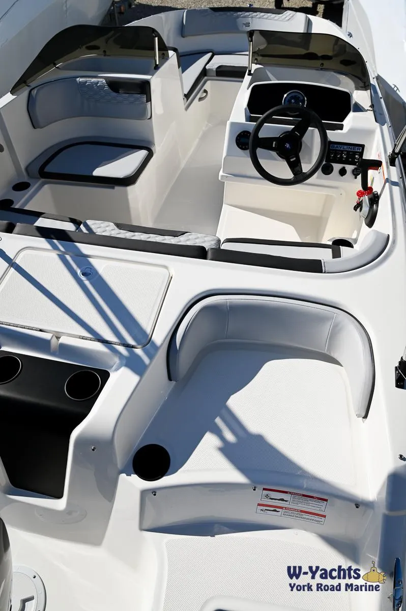 Slide: The Image of 2024 Bayliner M17 boat interior with seating and steering console. - 27