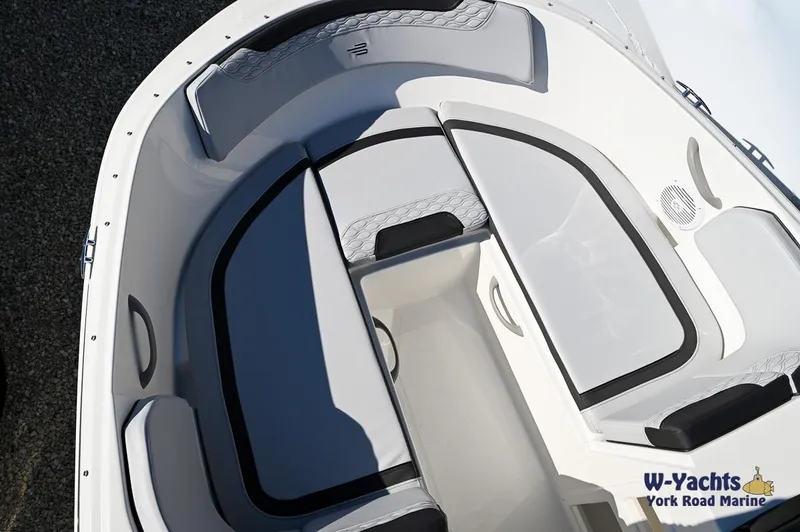 Slide: The Image of 2024 Bayliner M17 boat interior with seating and storage compartments. - 6