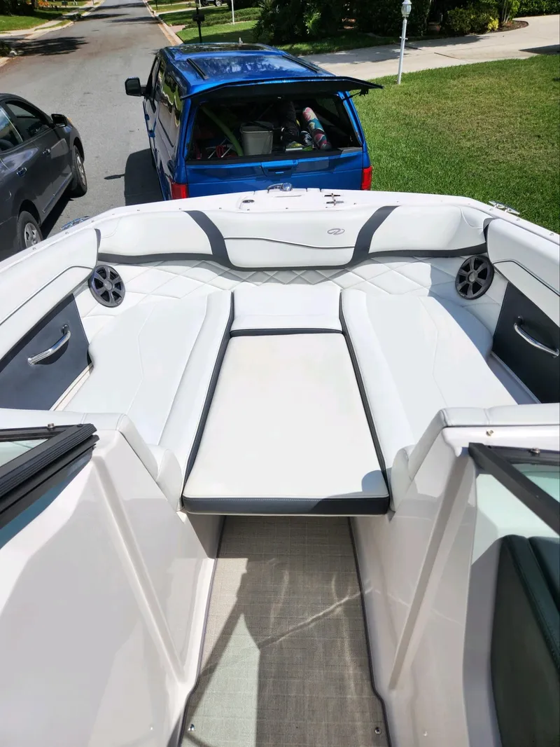 Slide: The Image of 2021 Regal 23 OBX boat interior with seating and speakers. - 4