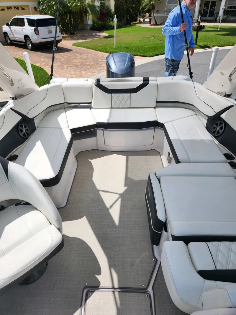 Slide: The Image of 2021 Regal 23 OBX boat interior with white seating and modern design. - 5