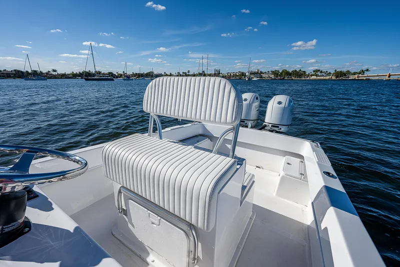 Slide: The Image of 2023 Dusky 27cc boat with dual engines on a sunny day. - 15