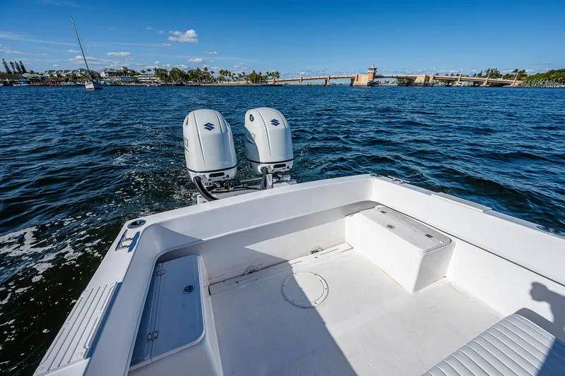 Slide: The Image of 2023 Dusky 27cc boat with dual engines on a sunny day. - 7