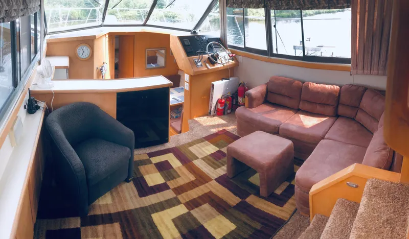 Slide: The Image of Interior of 1994 Carver 430 Cockpit Motor Yacht with cozy seating and helm station. - 10