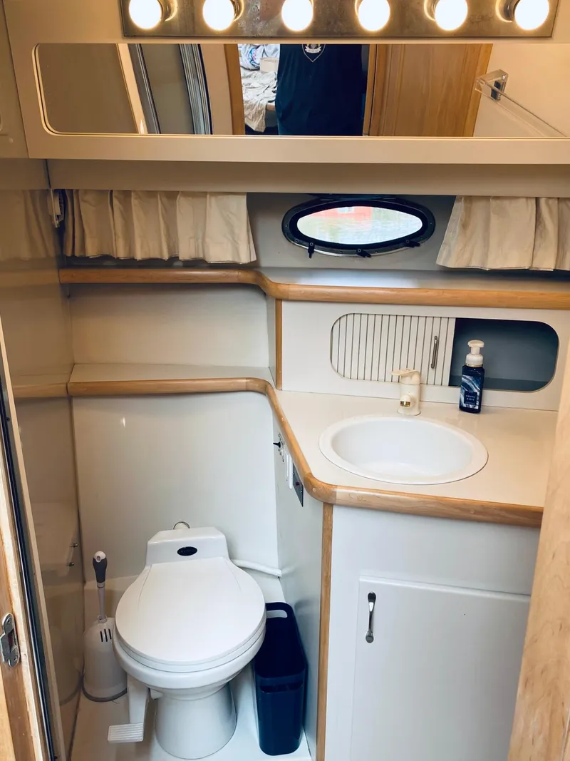 Slide: The Image of Bathroom interior of 1994 Carver 430 Cockpit Motor Yacht with sink and toilet. - 19