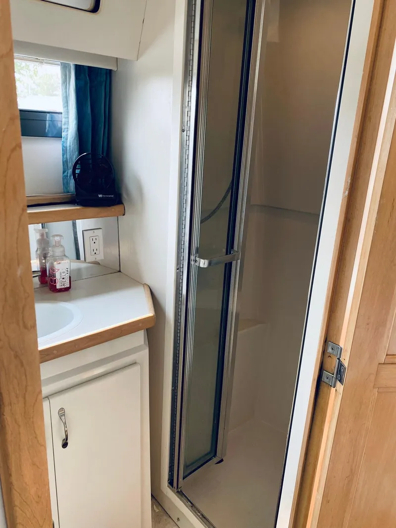 Slide: The Image of Bathroom in 1994 Carver 430 Cockpit Motor Yacht with shower and sink. - 18