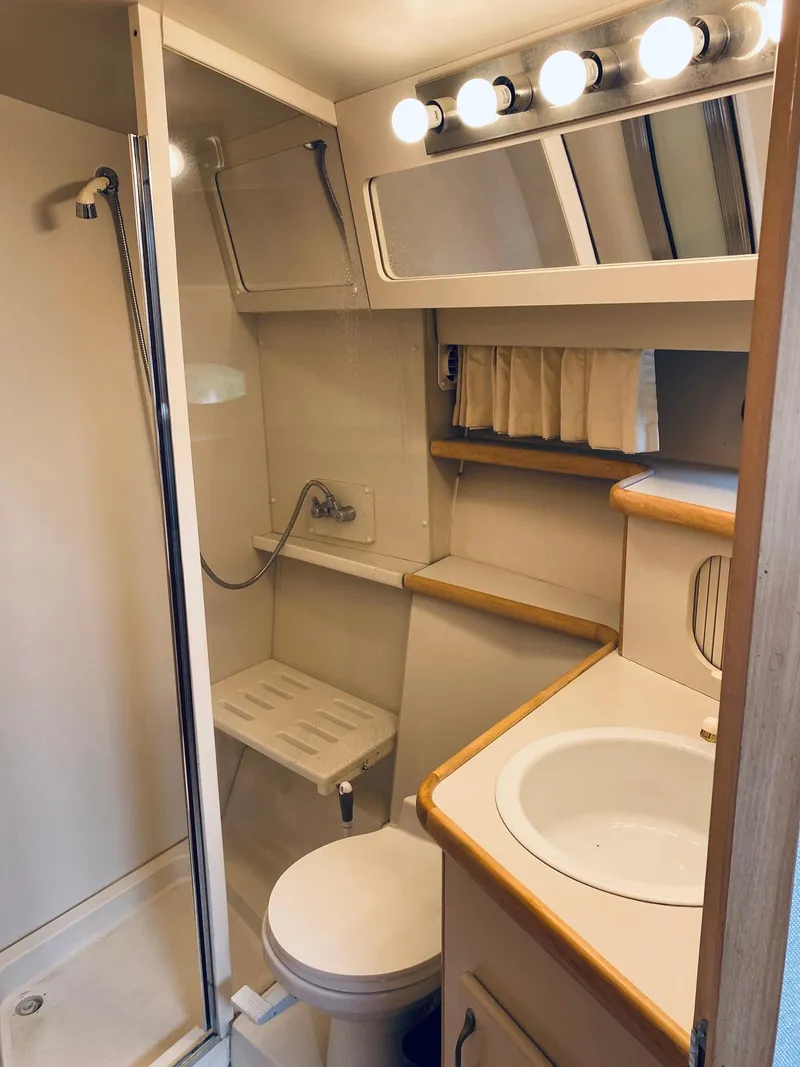 Slide: The Image of Bathroom interior of 1994 Carver 430 Cockpit Motor Yacht with shower and vanity. - 20