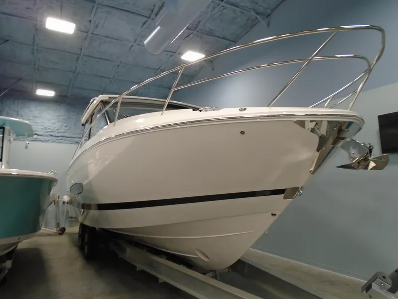 Slide: The Image of 2024 Regal 36 XO boat parked indoors. - 11