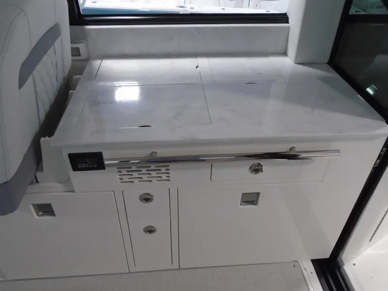 Slide: The Image of Interior of 2024 Regal 36 XO with white cabinetry. - 13