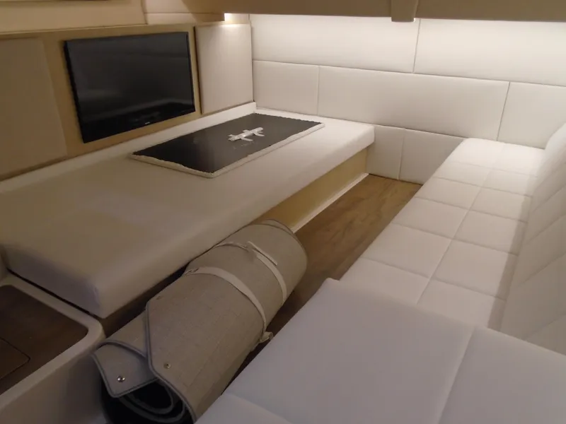 Slide: The Image of Interior of 2024 Regal 36 XO yacht with elegant white upholstery. - 24