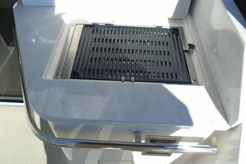 Slide: The Image of Outdoor grill on 2024 Regal 36 XO yacht, featuring sleek countertop design. - 45