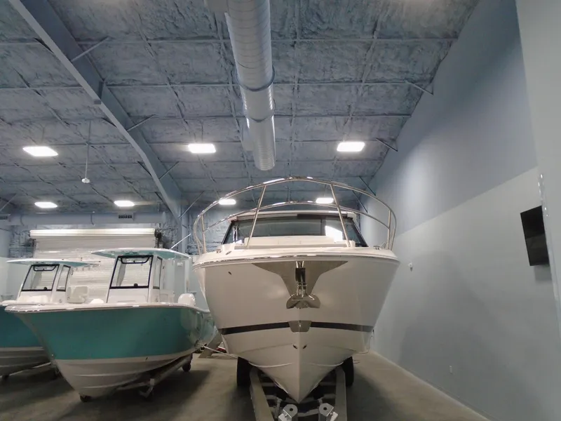 Slide: The Image of 2024 Regal 36 XO yacht in a storage facility. - 8
