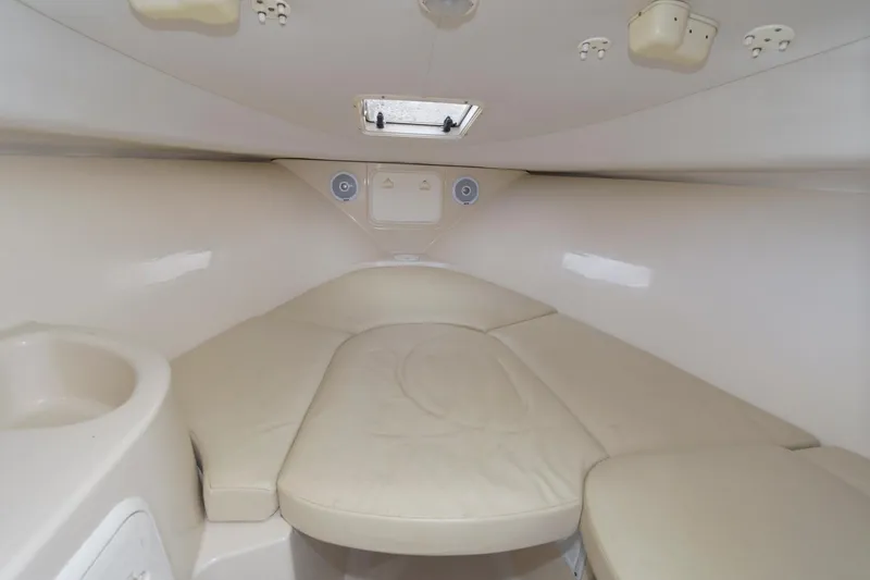Slide: The Image of Interior cabin of 2016 Wellcraft 232 Coastal boat with beige seating. - 10