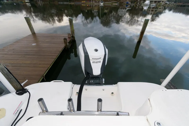 Slide: The Image of 2016 Wellcraft 232 Coastal boat with Evinrude 225 outboard motor at dock. - 12