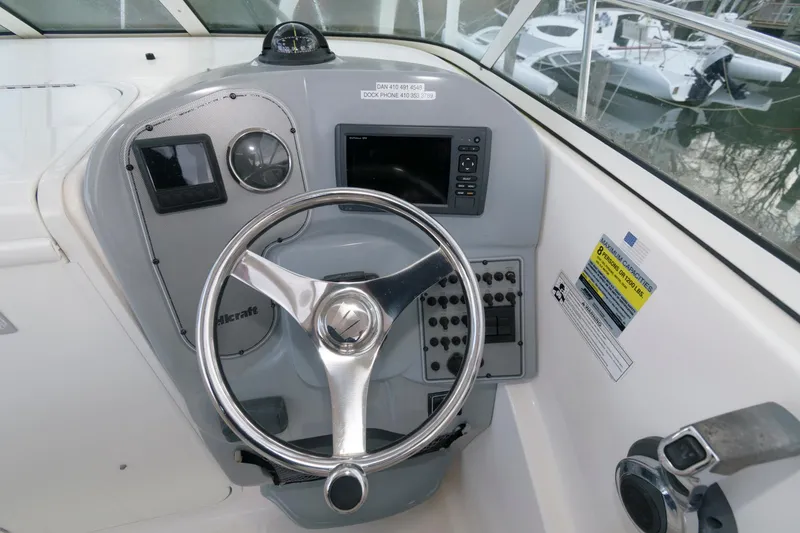 Slide: The Image of Helm of 2016 Wellcraft 232 Coastal boat with steering wheel and control panel. - 8