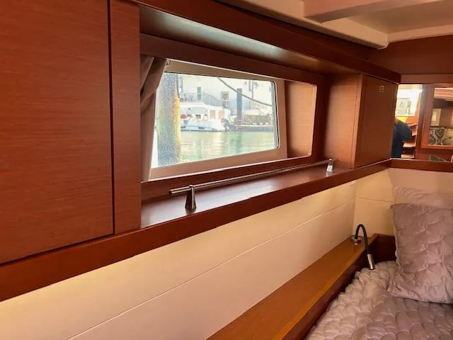 Slide: The Image of Interior cabin of 2013 Beneteau 48 yacht with window view. - 22