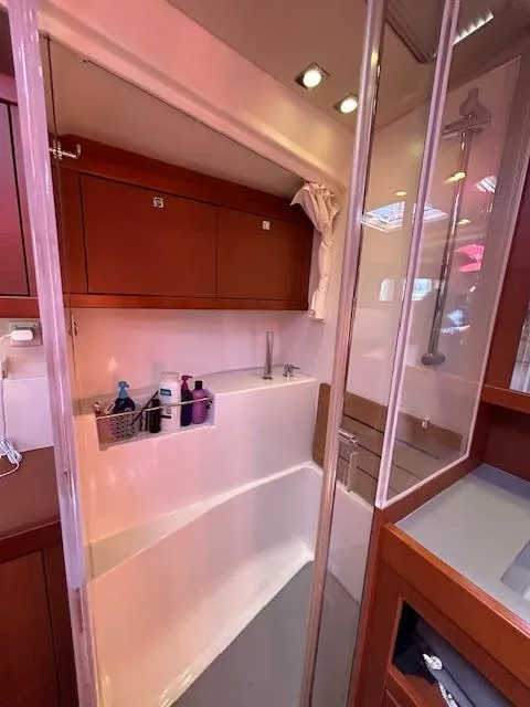 Slide: The Image of Hatch window on a 2013 Beneteau 48 sailboat. - 24