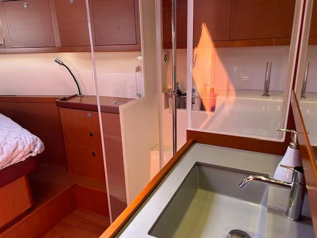 Slide: The Image of Luxurious interior of 2013 Beneteau 48 yacht with bedroom and ensuite bathroom. - 27