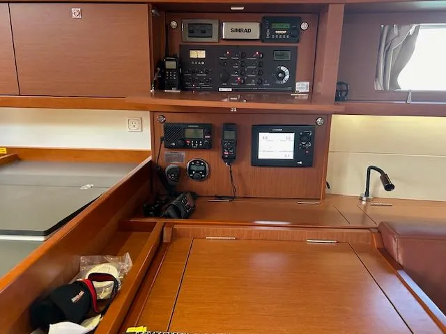 Slide: The Image of Open hatch on 2013 Beneteau 48 sailboat with sky view. - 30