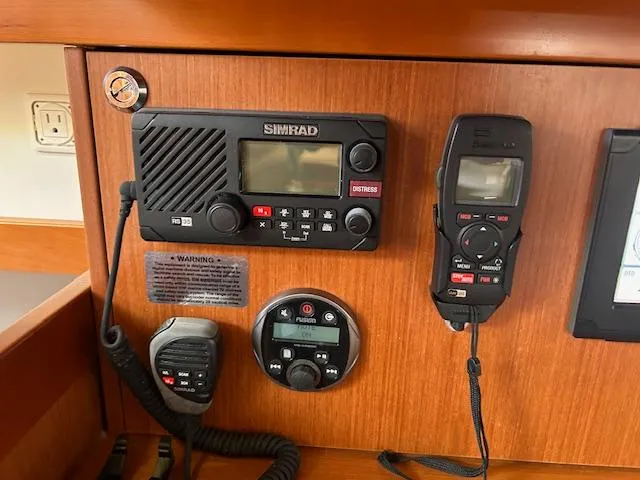 Slide: The Image of Navigation and control panel of a 2013 Beneteau 48 sailboat. - 32