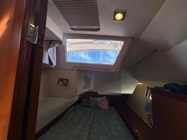 Slide: The Image of Beneteau 48 2013 model navigation equipment, featuring Simrad radio and control panel. - 34