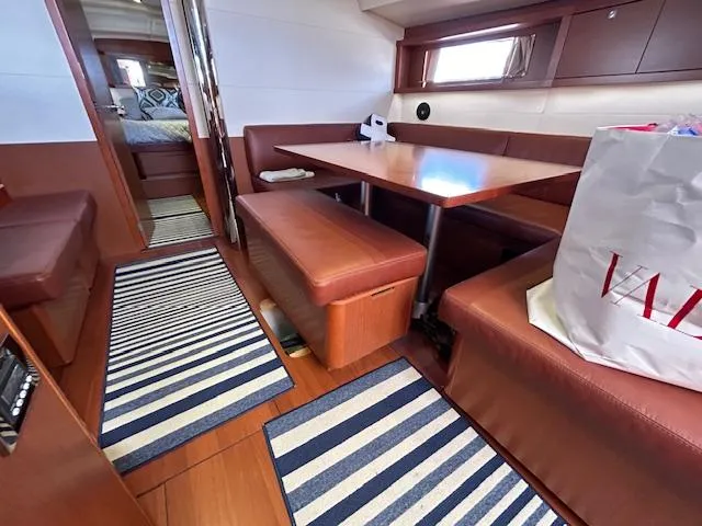 Slide: The Image of Interior cabin of 2013 Beneteau 48 sailboat with bed and skylight. - 36