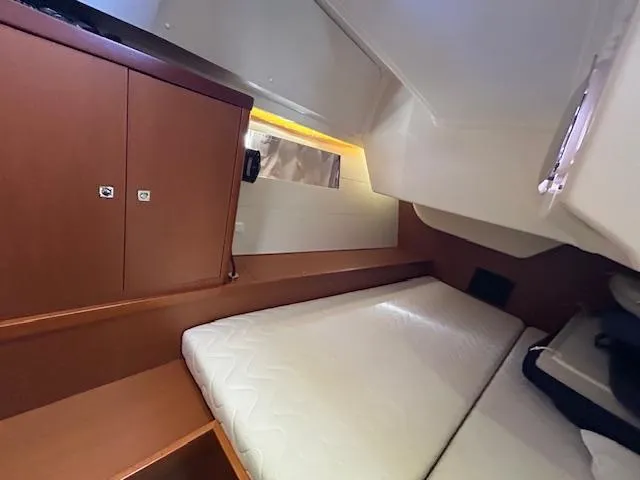 Slide: The Image of Interior of 2013 Beneteau 48 yacht with leather seating and dining table. - 39