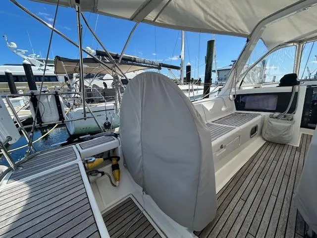 Slide: The Image of Cockpit view of a 2013 Beneteau 48 sailboat docked at a marina. - 4