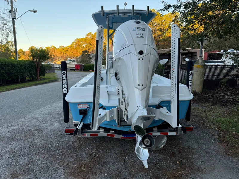 Slide: The Image of 2024 Contender 23 Bay boat with powerful 350 V8 engine on a trailer. - 4